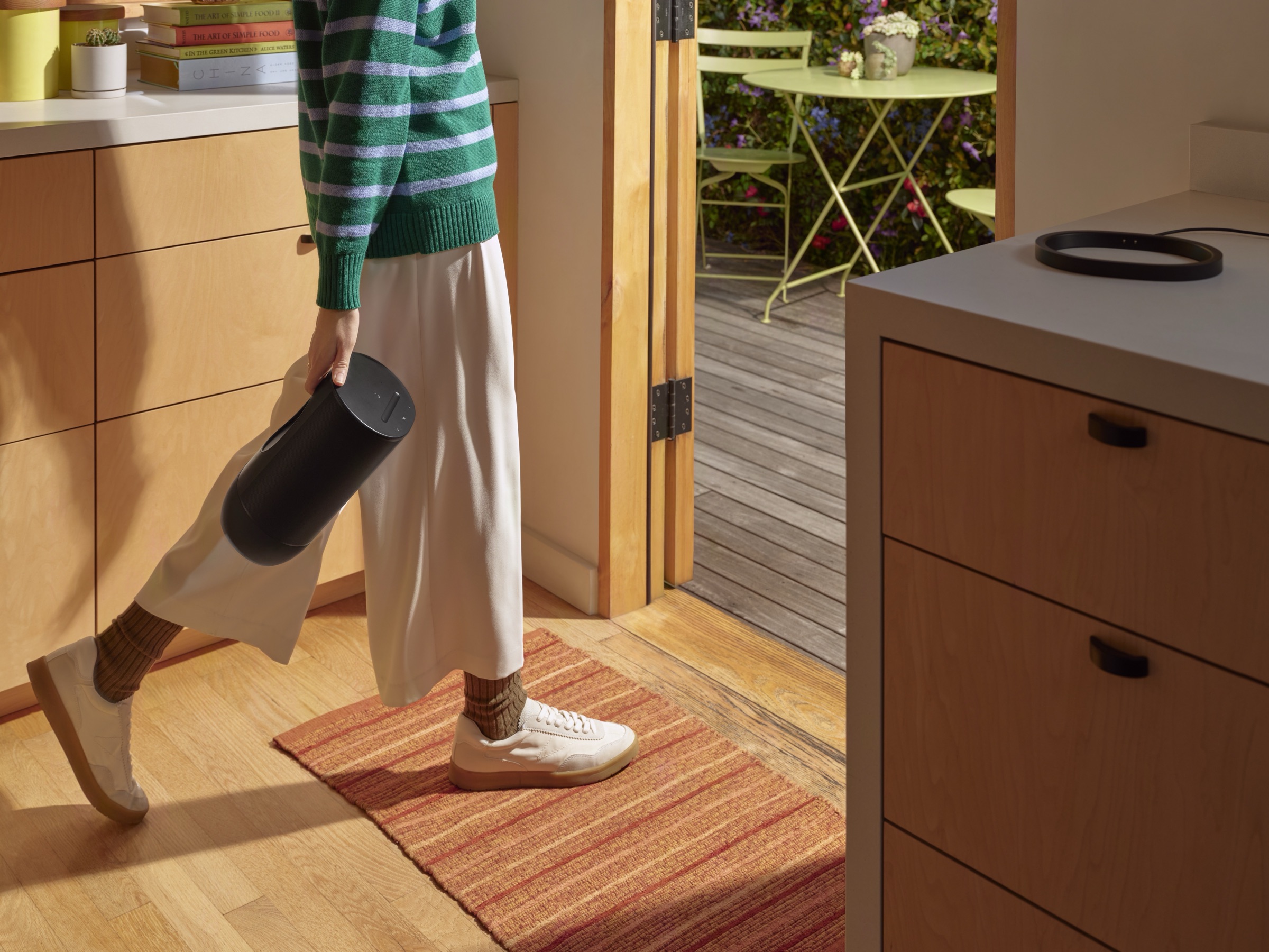Portable Sonos speaker near a doorway with signal challenges